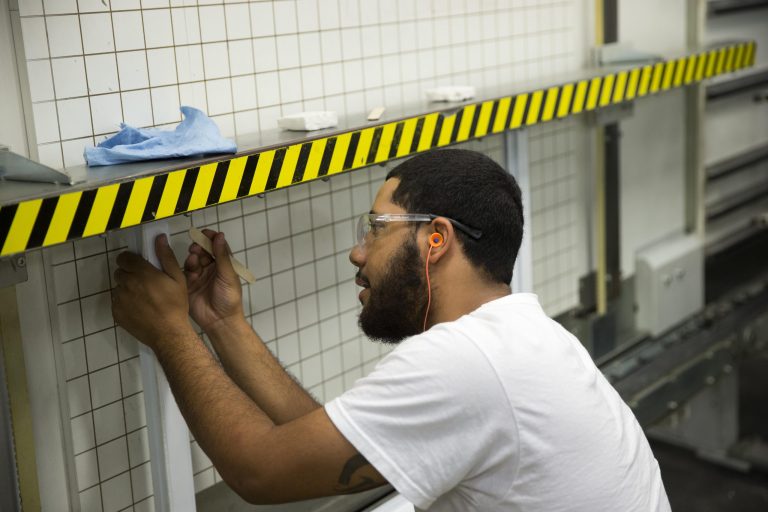 In this Aug. 7, 2014 photo, a worker assembles construction supplies at Northeast Building Products in Philadelphia. Labor Department releases second-quarter productivity data on Thursday, Sept. 4, 2014. (AP Photo/Matt Rourke)