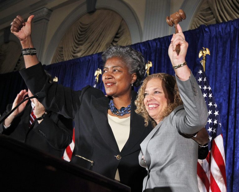 Former Democratic National Committee Chair Donna Brazile, left, raises her arms with newly elected Chair Rep. Debbie Wasserman Schultz, D-Fla., during a meeting of Democratic National Committee Wednesday, May 4, 2011 in Washington. Brazile replaced Wasserman Schultz last year after the Wikileaks email release of party discussions.(AP Photo/Alex Brandon)