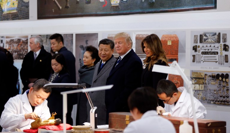 First lady Melania Trump, President Trump, Chinese President Xi Jinping and his wife Peng Liyuan tour the Conservation Scientific Laboratory of the Forbidden City in Beijing, China. (AP Photo/Andy Wong, Pool)