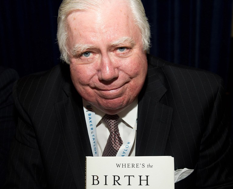 Jerome Corsi signs copies of his books at the Book Expo America in New York, Wednesday, May 25, 2011.