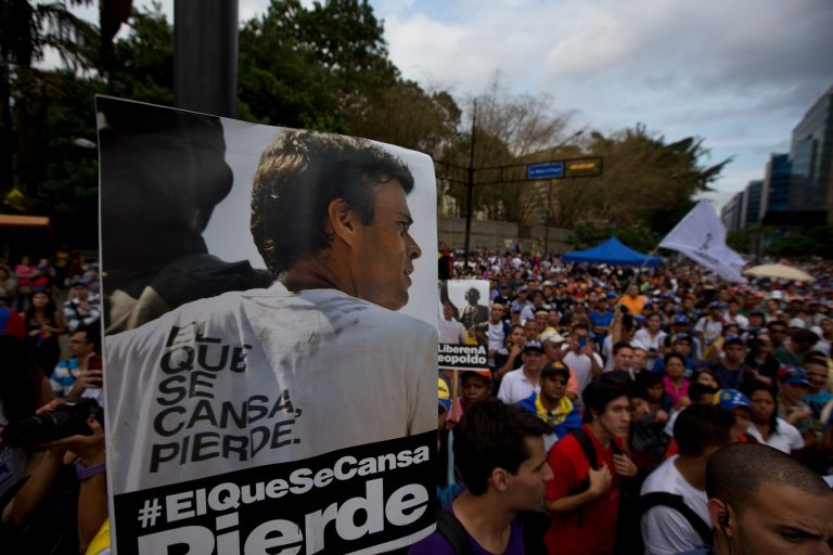 A poster of jailed opposition leader Leopoldo Lopez leads a protest to demand his freedom, in Caracas, Venezuela, Friday, April 4, 2014. The poster reads in Spanish 