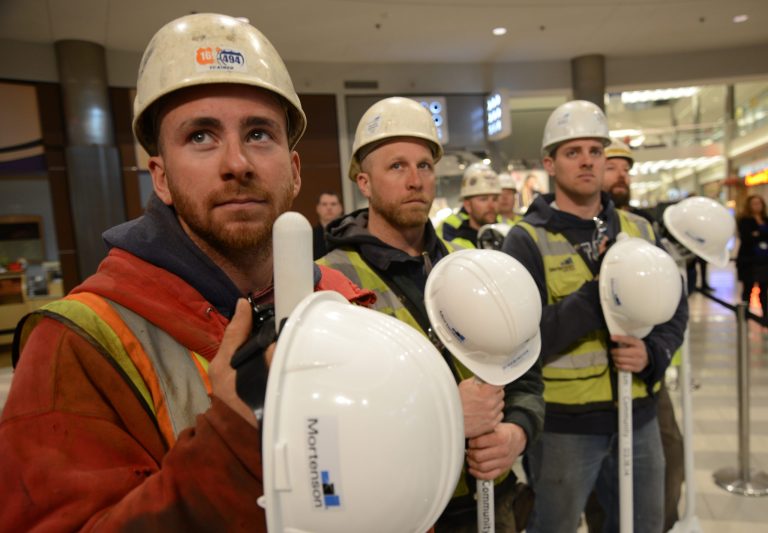 Construction workers look on during the groundbreaking ceremony for Mall of America's phase II, which will include a hotel, offices and more retail space, Tuesday, March 18, 2014, at the MOA Rotunda in Bloomington, Minn.  Over 1000 new construction  jobs  are expected to be generated from project. (AP Photo/The Star Tribune, Richard Sennott)  MANDATORY CREDIT; ST. PAUL PIONEER PRESS OUT; MAGS OUT; TWIN CITIES TV OUT
