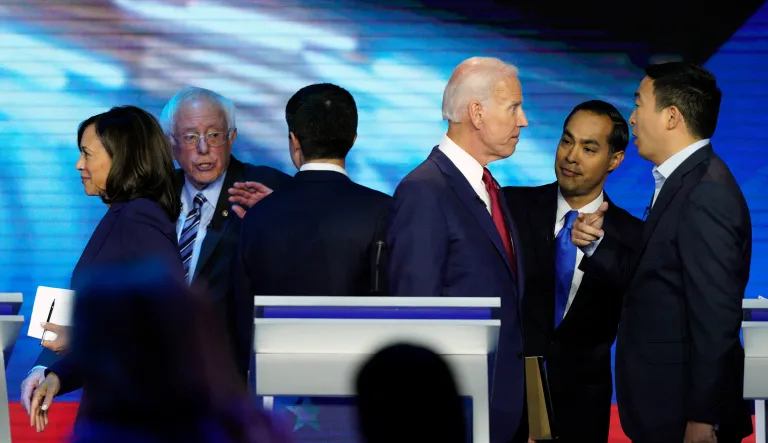 Democratic presidential candidates former Vice President Joe Biden, former Housing and Urban Development Secretary Julian Castro, and Andrew Yang, right, talk Thursday, Sept. 12, 2019, after a Democratic presidential primary debate hosted by ABC at Texas Southern University in Houston, as Sen. Kamala Harris, D-Calif., left, Sen. Bernie Sanders, I-Vt., and South Bend Mayor Pete Buttigieg talk.