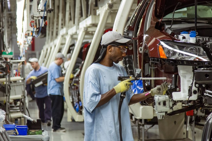 FILE - In this June 12, 2013 file photo, workers assemble Volkswagen Passat sedans at the German automaker's plant in Chattanooga, Tenn.  The United Auto Workers unions announced on Thursday, July 10, 2014, that it is forming a local chapter in Chattanooga, and that it expects Volkswagen to recognize it once it signs up a "substantial" number of workers at the plant.(AP Photo/ Erik Schelzig, file)