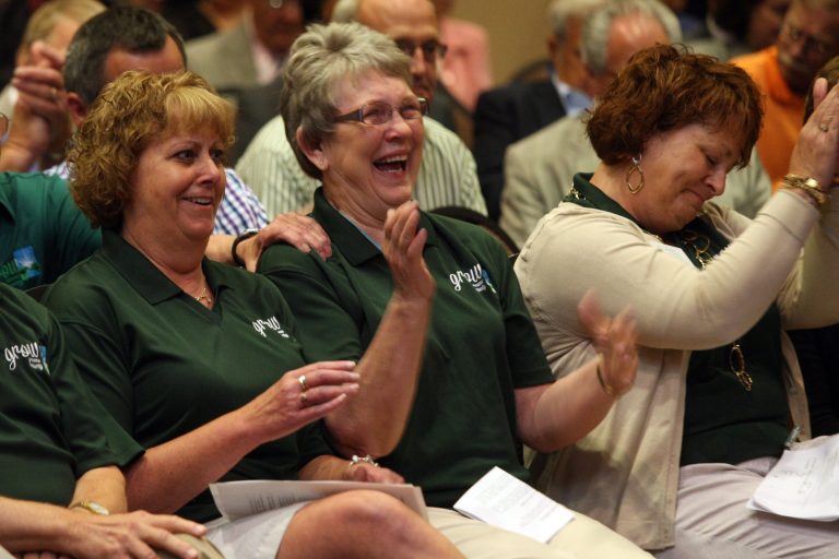 Members of the Grow Greene County Gaming Corp., from left, Brenda Muir, Mary Jane Fields, and Lori Mannel, react to the 3-2 vote by the Iowa Racing and Gaming Commission to award a casino license to the group during a meeting Thursday, June 12, 2014, in Burlington, Iowa. The $40 million casino development would be located in rural central Iowa near Jefferson. (AP Photo/The Hawk Eye, John Gaines)