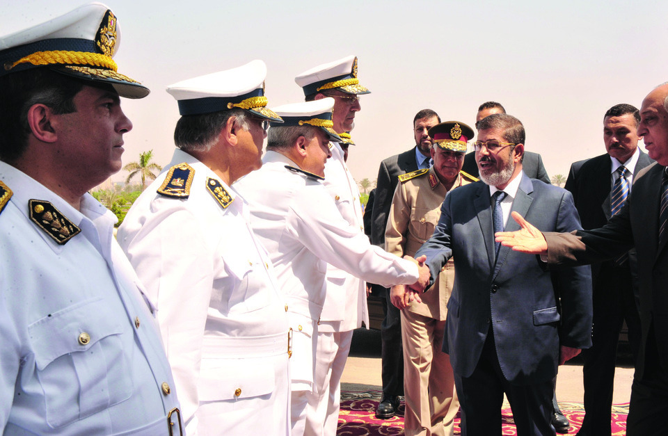 New Egypt president moves toward unity government