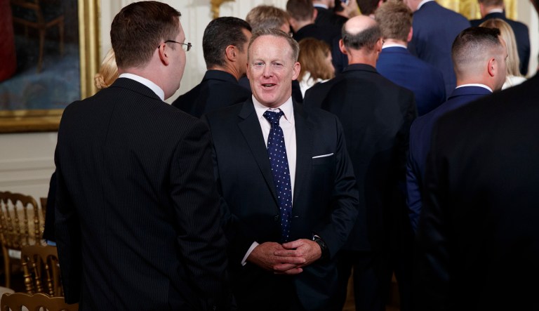 Former White House press secretary Sean Spicer talks as he leaves the East Room of the White House in Washington, Thursday, July 27, 2017, where President Donald Trump recognized the first responders from the June 14 Congressional baseball shooting. (AP Photo/Evan Vucci)