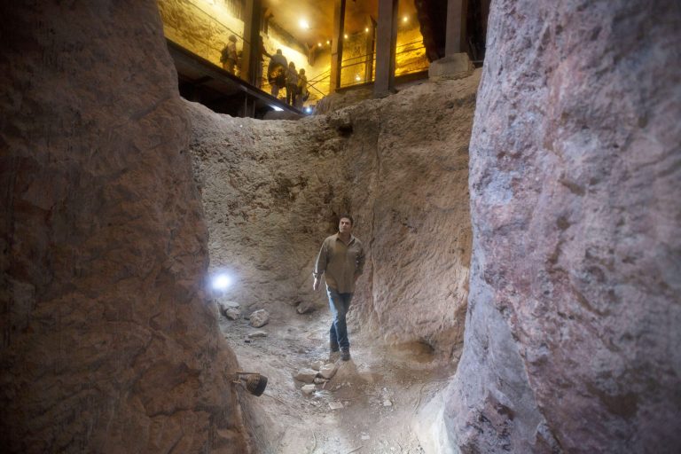 In this Thursday, May 1, 2014, photo, Eli Shukron, an archeologist formerly with Israel's Antiquities Authority, walks in the City of David archaeological site near Jerusalem's Old City. Shukron, who excavated at the site for nearly two decades, says he believes there is strong evidence that it is the legendary citadel captured by King David in his conquest of Jerusalem, rekindling a longstanding academic and political debate about using the Bible as a field guide to identifying ancient ruins. (AP Photo/Sebastian Scheiner)