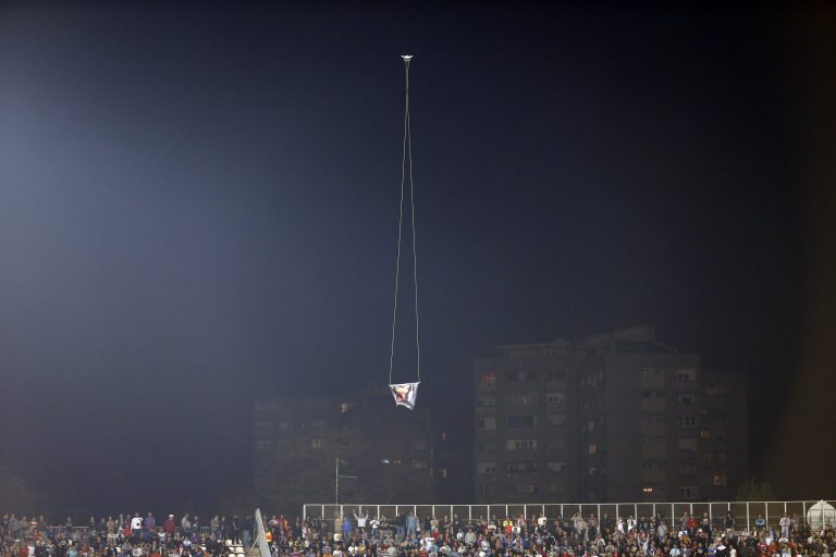 A drone flies over the Partizan stadium during the Euro 2016 Group I qualifying match between Serbia and Albania in Belgrade, Serbia, Tuesday, Oct. 14, 2014. A European Championship qualifier between Serbia and Albania was suspended on Tuesday after pitch skirmishes involving players and fans over an Albanian flag that was flown above the stadium by a drone. (AP Photo/Marko Drobnjakovic)