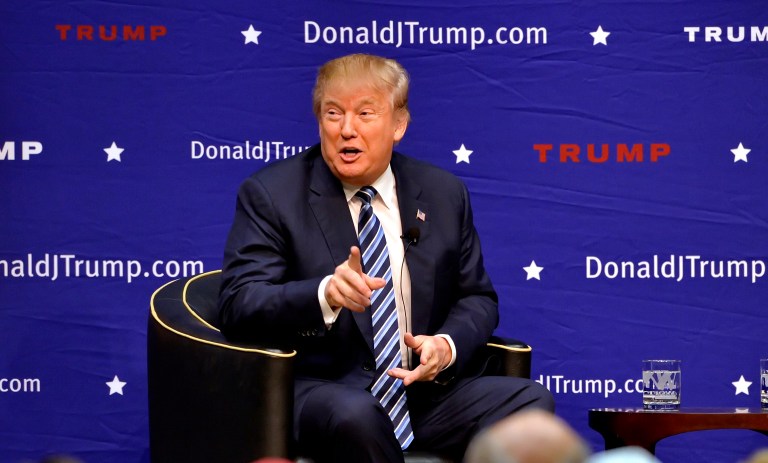 President-elect Trump's team is denying media reports and protesters' claims that he plans to make Muslims register with the government. (AP Photo/Richard Shiro)