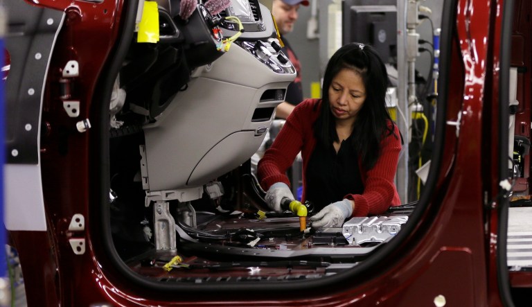 In this Friday, May 6, 2016, file photo, Tina Nguyen works on a 2017 Chrysler Pacifica on an assembly line at the Windsor Assembly Plant, in Windsor, Ontario. Canadian negotiators say the anti-union laws put its own businesses at too much of an economic disadvantage compared with the U.S. (AP Photo/Carlos Osorio, File)