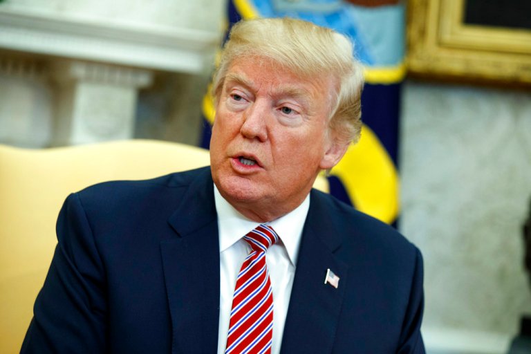 President Donald Trump speaks during a meeting with Shane Bouvet, a campaign volunteer, in the Oval Office of the White House, Friday, Feb. 9, 2018, in Washington. (AP Photo/Evan Vucci)