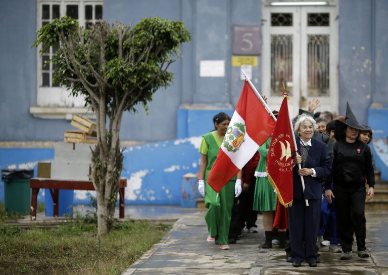 Patients of Larco Herrera Psychiatric Hospital march in their own Peruvian Independence Day parade through hospital grounds, in Lima, Peru, Wednesday, July 23, 2014. The annual parade is organized ahead of Peru's official Independence Day celebrations on July 28. (AP Photo/Martin Mejia)