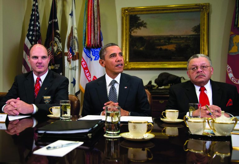 FILE - In this Jan. 28, 2013, file photo President Barack Obama meets to discuss administration policies to reduce gun violence with representatives from Major Cities Chiefs Association and Major County Sheriffs Association at the White House in Washington. The National Rifle Association is using a Justice Department memo it obtained to argue in ads that the Obama administration believes its gun control plans won't work unless the government seizes firearms and requires national gun registration, ideas the White House has not proposed and does not support. At left isHennepin County Minnesota Sheriff Richard W. Stanek, and at right is Charles H. Ramsey Police, Commissioner of the Philadelphia Police Department. (AP Photo/Carolyn Kaster)