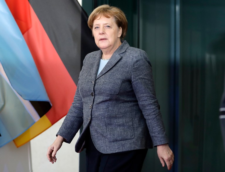 President Trump and German Chancellor Angela Merkel will now meet on March 17. (AP Photo/Michael Sohn)