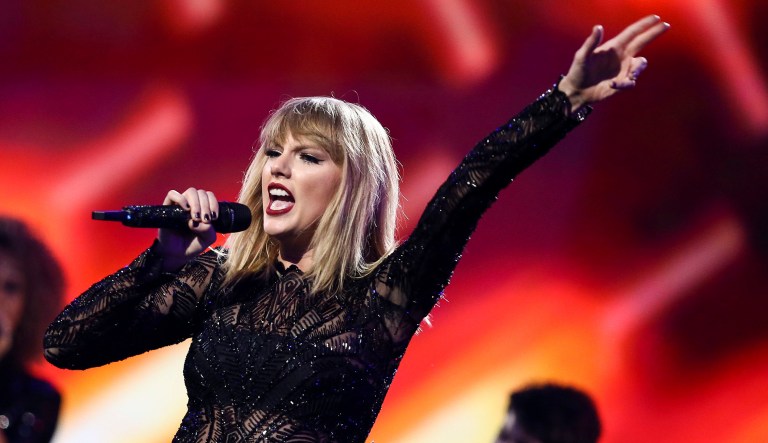 The blonde American idol knows how to build a devoted audience, how to fill the biggest stadiums, and how to completely disrupt an entire industry. But to really understand that golden-haired phenom, to actually grasp the essence of Donald Trump, one needs to consider Taylor Swift. (Photo by John Salangsang/Invision/AP)
