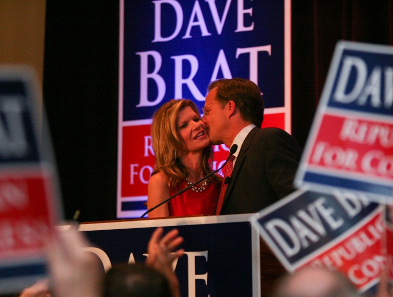 Republican 7th District congressman-elect, Dave Brat, right, gives his wife Laura a kiss before leaving the podium during his election party in Richmond, Va., Tuesday Nov. 4. (AP/Skip Rowland)