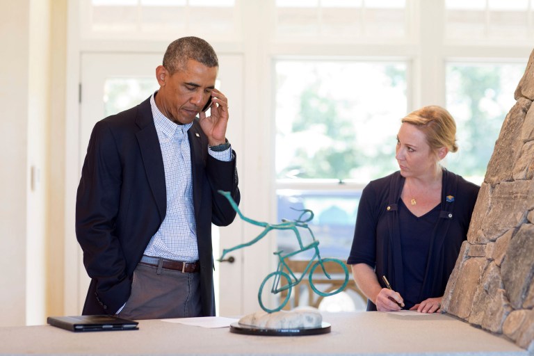President Obama talks on the phone with Missouri Gov. Jay Nixon about the situation in Ferguson, Mo., in Chilmark, Martha's Vineyard, Mass., August 14, 2014. Deputy Chief of Staff Anita Breckenridge is at right.ÃÂ (Official White House Photo by Pete Souza)