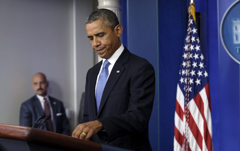 President Barack Obama prepares to make a statement on the ongoing budget battle from the Brady Press Briefing Room at the White House in Washington, Monday, Sept. 30, 2013. Obama is ramping up pressure on Republicans to avoid a post-midnight government shutdown. He says a shutdown would hurt the economy and hundreds of thousands of government workers. (AP Photo/Susan Walsh)