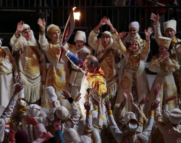 Vladislav Tretyak carries the torch during the opening ceremony of the 2014 Winter Olympics in Sochi, Russia, Friday, Feb. 7, 2014. (AP Photo/Ivan Sekretarev)