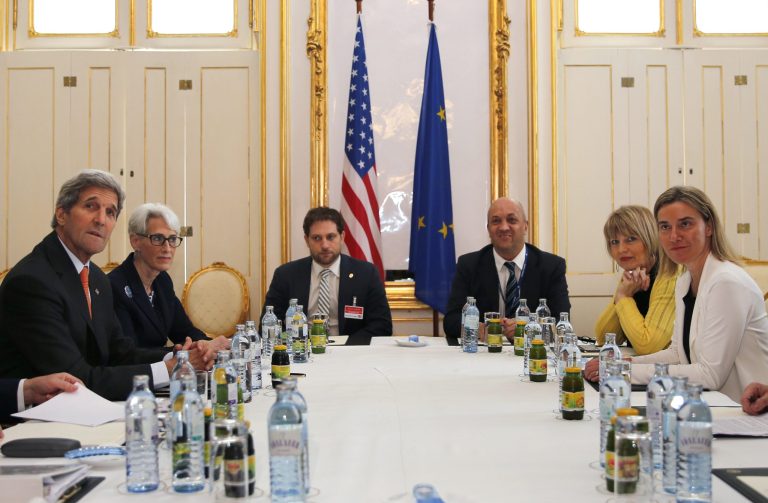 Secretary of State John Kerry, left, and U.S. Under Secretary for Political Affairs Wendy Sherman, 2nd left, meet with European Union foreign policy chief Federica Mogherini, right, at a hotel in Vienna, Sunday June 28, 2015. A senior U.S. official acknowledged Sunday that Iran nuclear talks will go past their June 30 target date, as Iran's foreign minister prepared to head home Sunday for consultations before returning to push for a breakthrough. (Carlos Barria/Pool via AP)