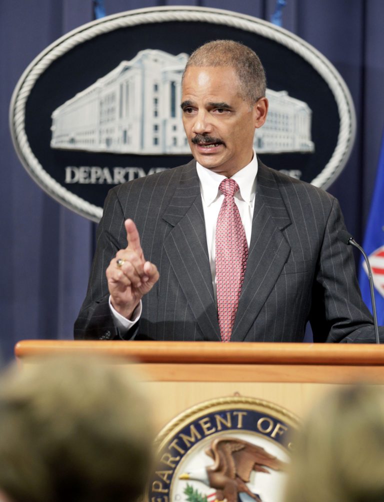   This Oct. 4, 2010 file photo shows Attorney General Eric Holder speaking during a news conference at the Justice Department in Washington. Holder is calling for major changes to the nation's criminal justice system that would scale back the use of harsh prison sentences for certain drug-related crimes, divert people convicted of low-level offenses to drug treatment and community service programs and expand a prison program to allow for release of some elderly, non-violent offenders. (AP Photo/Carolyn Kaster, File)  
