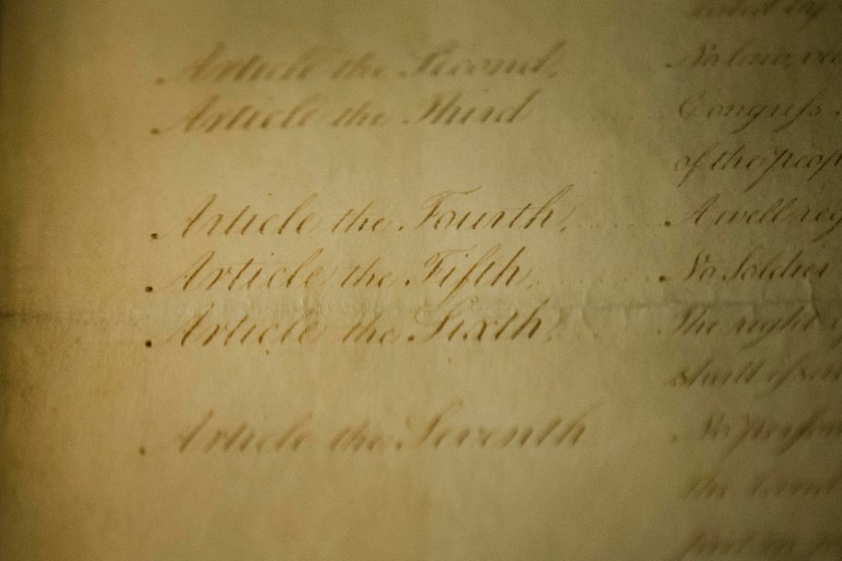 The Trump administration did not quietly amend the language to the Bill of Rights as it appears on the White House website, contrary to a claim spread this week on Twitter. (AP Photo/Matt Rourke)