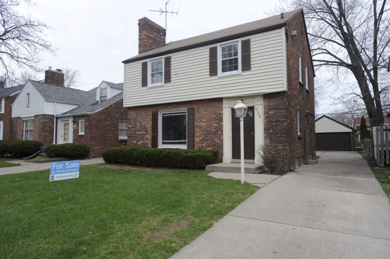 This May 5, 2014 photo shows a city-owned home to be offered  in a new one-day auction in Detroit.  Detroit's effort to auction off vacant, city-owned houses to people willing to quickly fix them up is getting attention from potential buyers. One home is being auctioned each weekday. The auctions are part of the city's effort to eradicate blight while stabilizing neighborhoods. (AP Photo/Detroit News, David Coates)  DETROIT FREE PRESS OUT; HUFFINGTON POST OUT