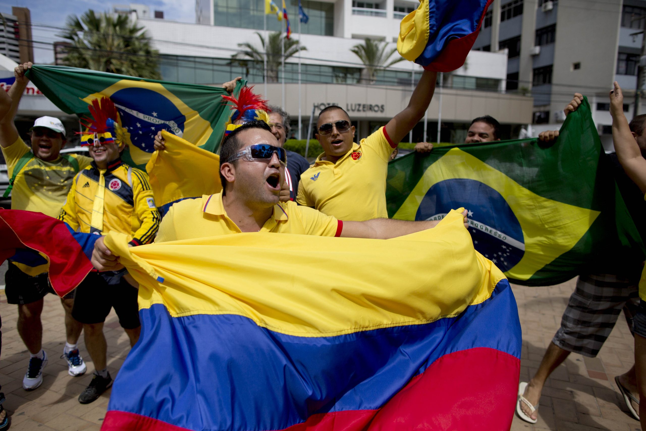 Travel weary Colombians keep party going in Brazil