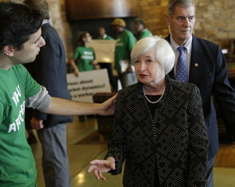 Federal Reserve Chairwoman Janet Yellen, right, speaks with Ady Barkan of the Center for Popular Democracy as she arrives for a dinner during the Jackson Hole Economic Policy Symposium at Jackson Lake Lodge in Grand Teton National Park, Wyoming, Thursday. (AP Photo/John Locher)