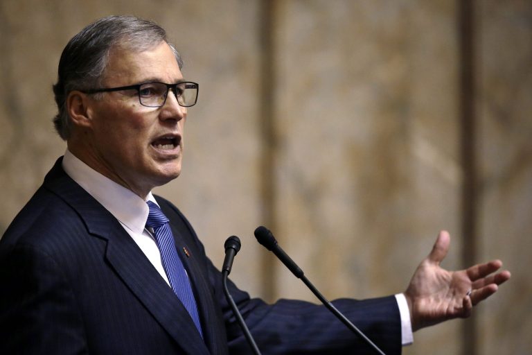 FILE - In a Tuesday, Jan. 14, 2014 file photo, Gov. Jay Inslee speaks during the annual State of the State address to a joint session of the Legisture in the House chambers, in Olympia, Wash. Inslee, saying too many parents with full-time jobs are struggling to put food on the table for their families, has proposed raising Washington's minimum wage by as much as $2.50 an hour. (AP Photo/Elaine Thompson, File)