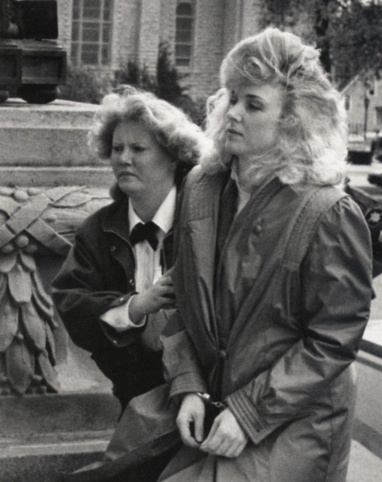 ADVANCE FOR USE SUNDAY, JULY 6 AND THEREAFTER - In this Oct. 24, 1988 photo, Nancy Rish, right, is seen being escorted outside a courthouse in Kankakee during her trial related to the 1987 kidnapping and killing of Stephen Small, of Kankakee. After 27 years in prison, Rish, now 52, who says she was wrongfully convicted in the notorious case, may get her chance at freedom when the Illinois Prisoner Review Board hears her petition on Tuesday, July 8, 2014. (AP Photo/The Daily Journal)