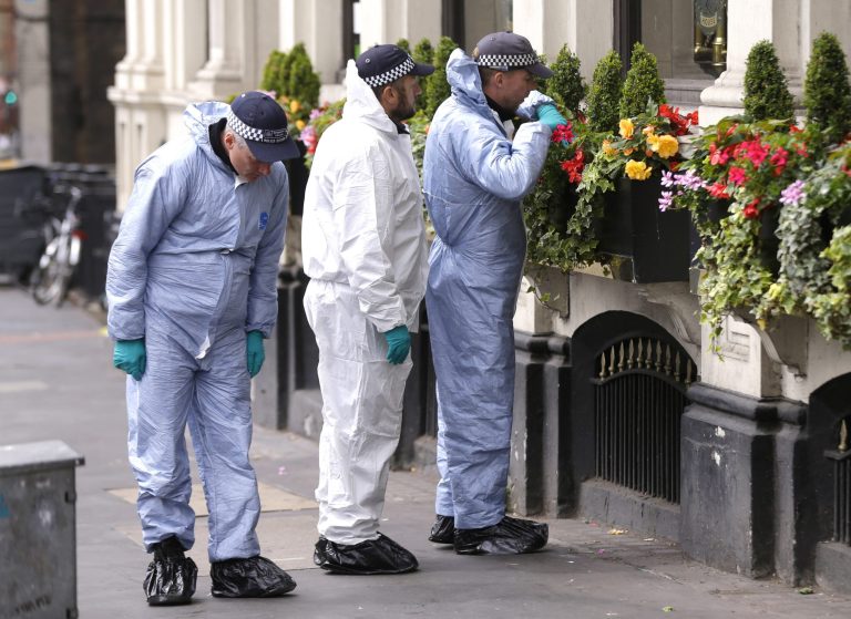Forensic police investigate around the Borough Market and London Bridge area of London, Monday, June 5, 2017. Police arrested several people and are widening their investigation after a series of attacks described as terrorism killed several people and injured more than 40 others in the heart of London on Saturday. (AP Photo/Alastair Grant)