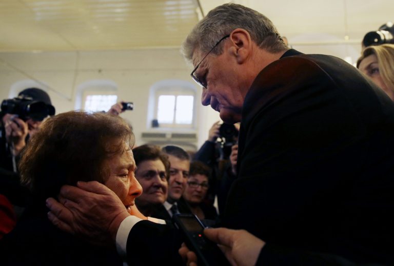 German President Joachim Gauck, right, hugs 93-year-old Stella Coen, a Greek Jewish death camp survivor, during his visit at Synagoge in Ioannina, northwestern Greece, on Friday, March 7, 2014. Gauck's met two death camp survivors and a Greek Jewish partizan of the World War II against Nazis after a wreath-laying ceremony at the monument in memory for dozens of villagers massacred by German army troops in 1943, in retaliation for the killing of a German officer by partisans, at the nearby village of Ligiades. (AP Photo/Thanassis Stavrakis)