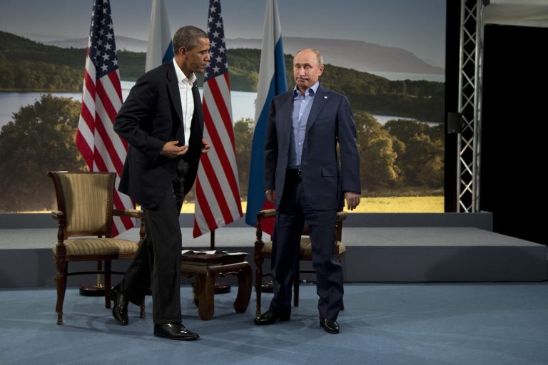   FILE - In this June 17, 2013 file photo, President Barack Obama and Russian President Vladimir Putin get up to leave after their meeting in Enniskillen, Northern Ireland. The Kremlin voiced disappointment Wednesday, Aug. 7, with Obama's decision to cancel his Moscow summit with Putin, but said it remains ready to cooperate with the United States on bilateral and international issues. (AP Photo/Evan Vucci, File)  