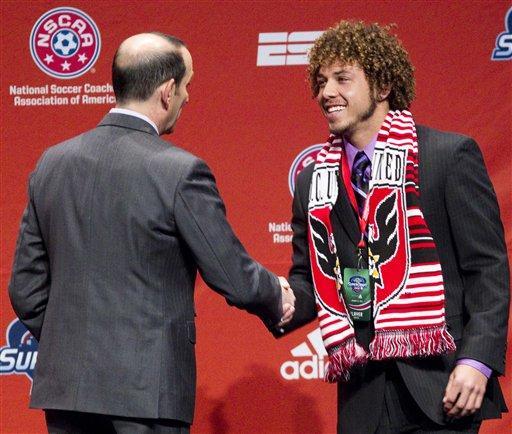 Major League Soccer Commissioner Don Garber, left, welcomes Nick DeLeon, the seventh player drafted in the first round by D.C. United, to the stage during the 2012 Major League SoccerSuper Draft at the Kansas City Convention Center on Thursday, Jan. 12, 2012, in Kansas City, Mo. 