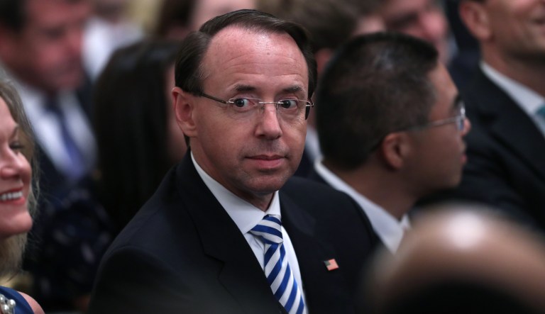 Rod Rosenstein, deputy attorney general, center, sits during a ceremonial swearing-in event for Brett Kavanaugh, associate justice of the U.S. Supreme Court, in the East Room of the White House in Washington, D.C., U.S., on Monday, Oct. 8, 2018.