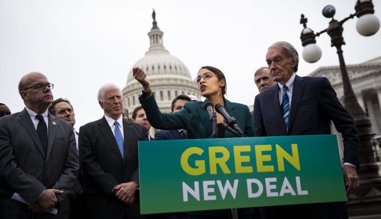 Rep. Alexandria Ocasio-Cortez, D-N.Y., speaks as Sen. Ed Markey, D-Mass., right, listens during a news conference announcing Green New Deal legislation in Washington, D.C., on Thursday, Feb. 7, 2019.