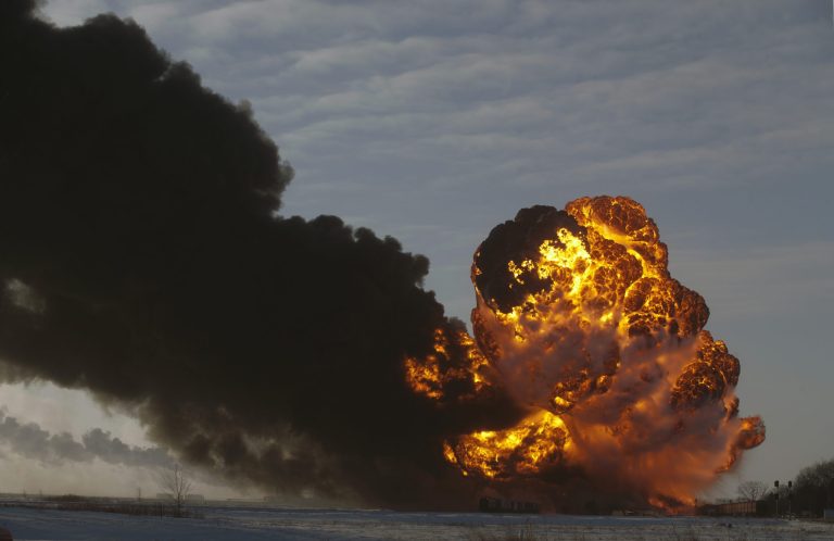 FILE - In this Dec. 30, 2013 file photo, a fireball goes up at the site of an oil train derailment in Casselton, N.D.  Rail cars being used to ship crude oil from North Dakota's Bakken region are an 