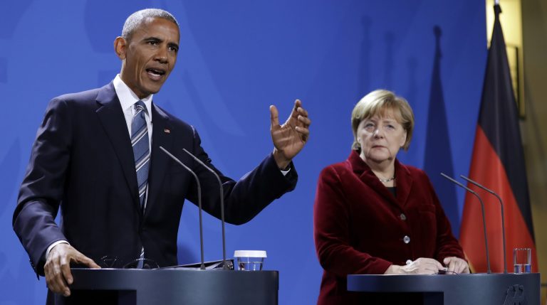 President Obama and German Chancellor Angela Merkel penned a joint op-ed, offering an early rebuke of President-elect Trump's foreign policy. (AP Photo/Michael Sohn)