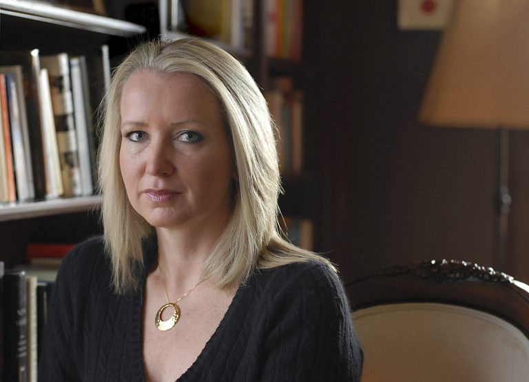 Liz Seccuro poses in her home office in Greenwich, Conn. in 2006. Seccuro, a victim of vicious rape in 1984, has gone public with her story, hoping to raise awareness of sexual assault and inspire victims to seek help. (AP)