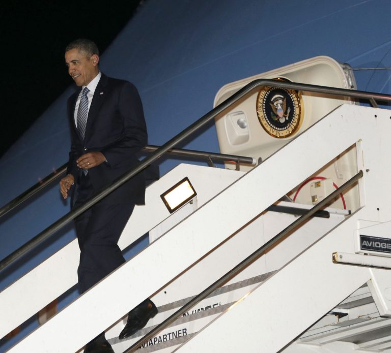 President Barack Obama walks down the stairs from Air Force One upon his arrival at Fiumicino Airport, Rome, Italy, Wednesday, March 26, 2014. (AP Photo/Pablo Martinez Monsivais)