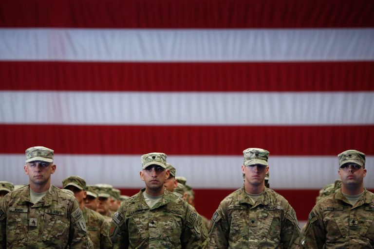 Soldiers from the U.S. Army's 3rd Brigade Combat Team, 1st Infantry Division, stand to attention while being introduced during a homecoming ceremony in the Natcher Physical Fitness Center on Fort Knox in the early morning hours of Wednesday, November 20, 2013 in Fort Knox, Ky. (Photo by Luke Sharrett/Getty images)