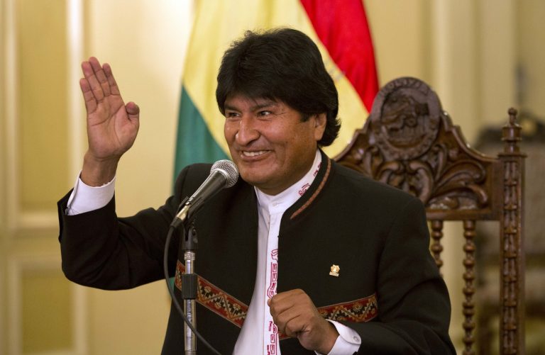 Bolivia's President Evo Morales speaks during a news conference at Government Palace in La Paz, Bolivia, Monday, Oct. 13, 2014. Morales coasted to victory in Bolivia's Sunday presidential elections, winning an unprecedented third term as voters rewarded the former coca grower for delivering economic and political stability in what has traditionally been one of South America's most ungovernable nations. (AP Photo/Martin Mejia)