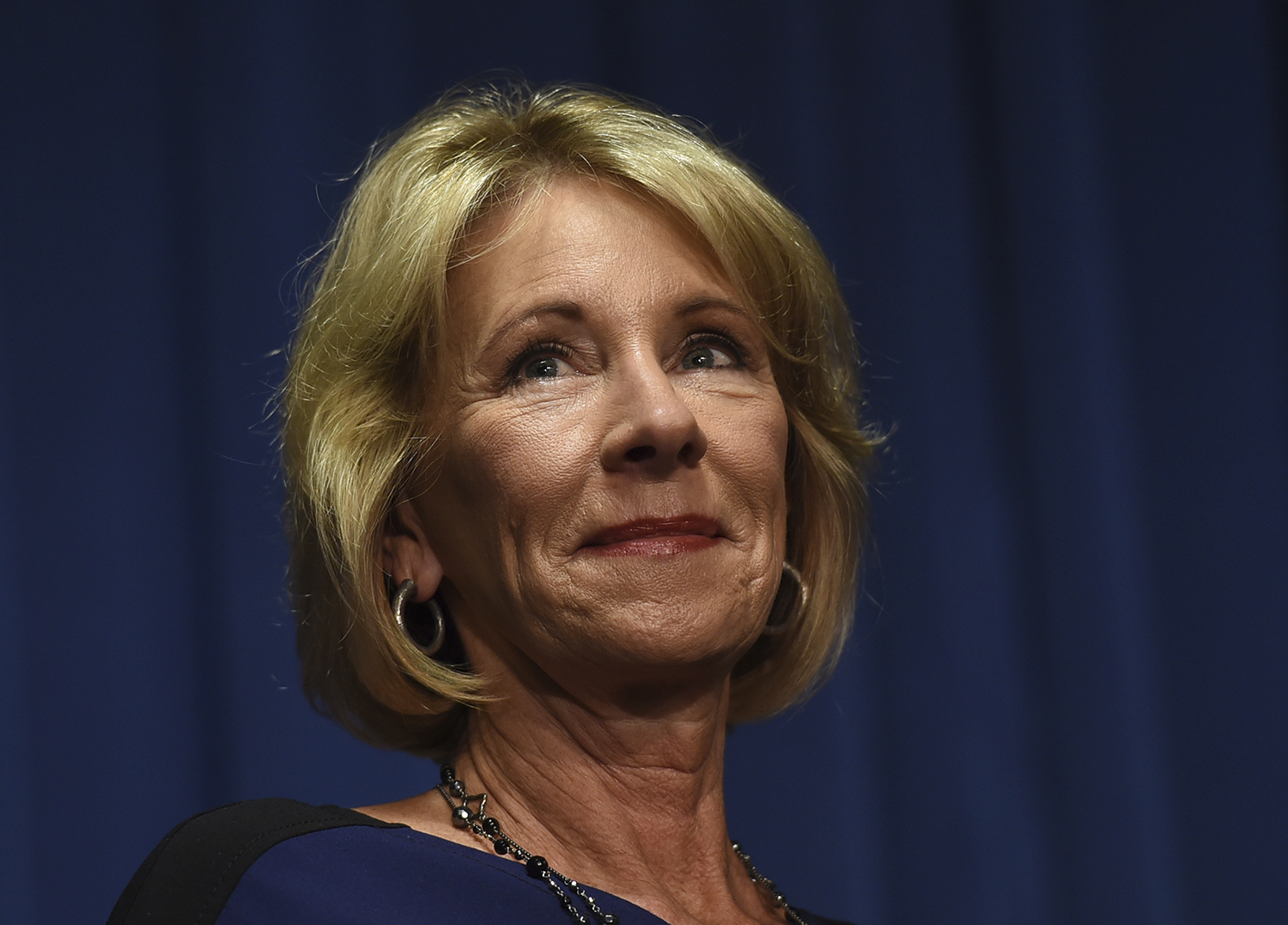 Protester held a Black Lives Matter sign while keeping DeVos from meeting with a 94% black school