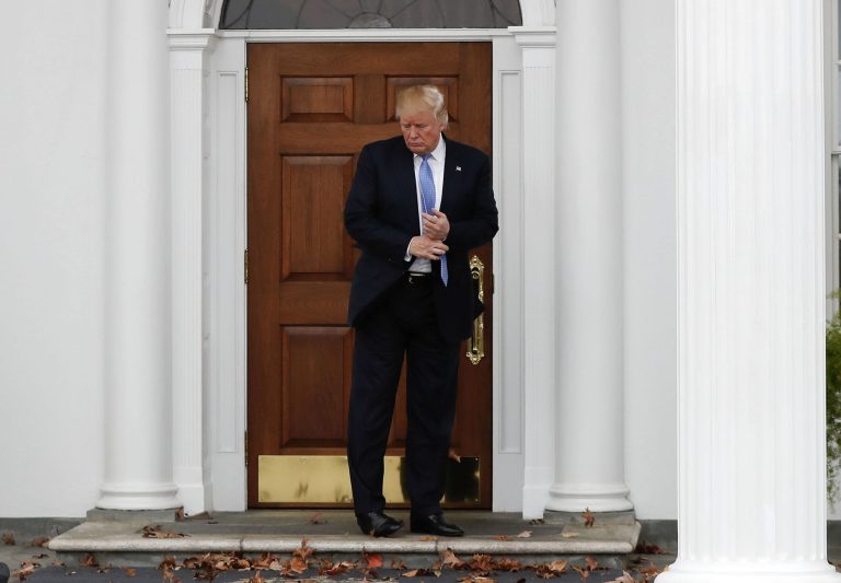 President-elect Donald Trump pauses at the entrance of Trump National Golf Club Bedminster clubhouse, Sunday, Nov. 20, 2016, in Bedminster, N.J., during a day of meetings. (AP Photo/Carolyn Kaster)