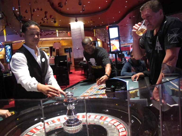 In this May 21, 2012 photo, a dealer at Revel Casino Hotel prepares for a round of roulette at the Atlantic City, N.J. casino as patrons await the result. The president of Revel Casino Hotel says potential buyers are all interested in keeping the Atlantic City casino resort open after a sale. The main casino workers' union has expressed concern that a sale could result in the shutdown of the casino or large-scale job losses, but Scott Kreeger said Thursday, March 27, 2014 that all the interested parties Revel has spoken with plan to continue operating it. He did not indicate how many potential suitors had been contacted, nor did he identify them.  (AP Photo/Wayne Parry)