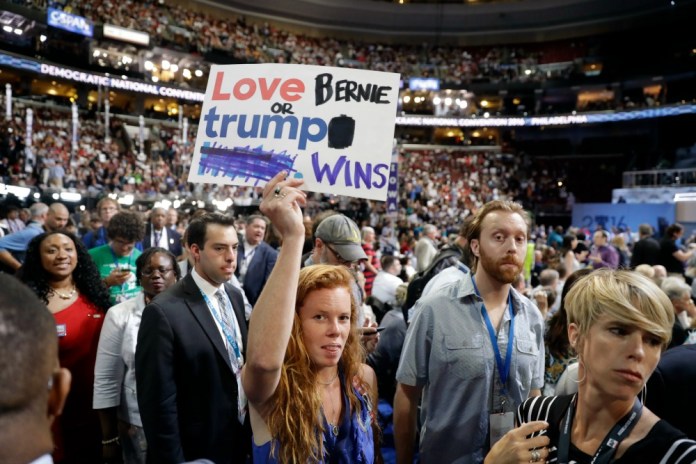 Following a day of dissent in Philadelphia, the Sanders campaign sent texts to Sanders delegates asking them not to protest on the floor Monday night —œout of courtesy—&pound; to the Vermont Senator. (AP Photo)