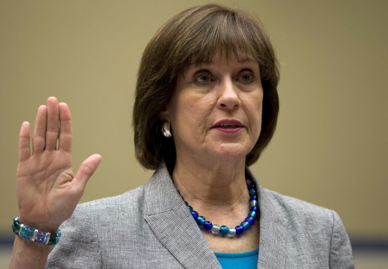 Then-IRS official Lois Lerner is sworn in on Capitol Hill in Washington, before the House Oversight Committee hearing to investigate the extra scrutiny IRS gave to tea party and other conservative groups that applied for tax-exempt status. The House is preparing to vote May 7, on holding Lerner in contempt of Congress for refusing to testify at a pair of committee hearings about her role in the agency's tea party controversy. (AP/Carolyn Kaster)