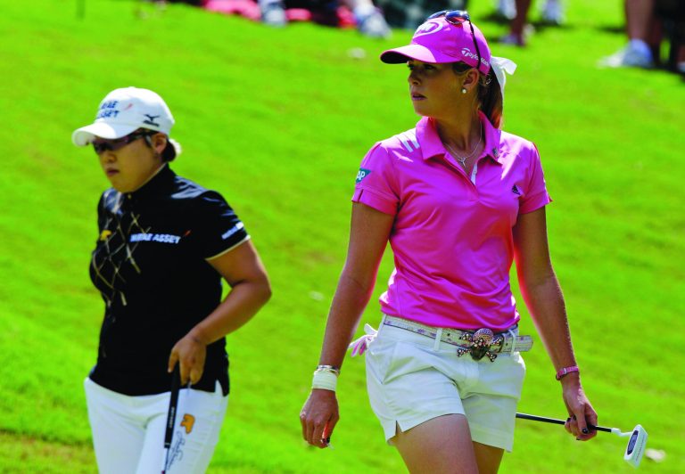Steve Helber/AP
Paula Creamer, right, and Jiyai Shin played the 18th hole eight times trying to break a first-place tie on Sunday night.